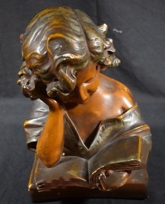 Bronze statue of a young woman reading