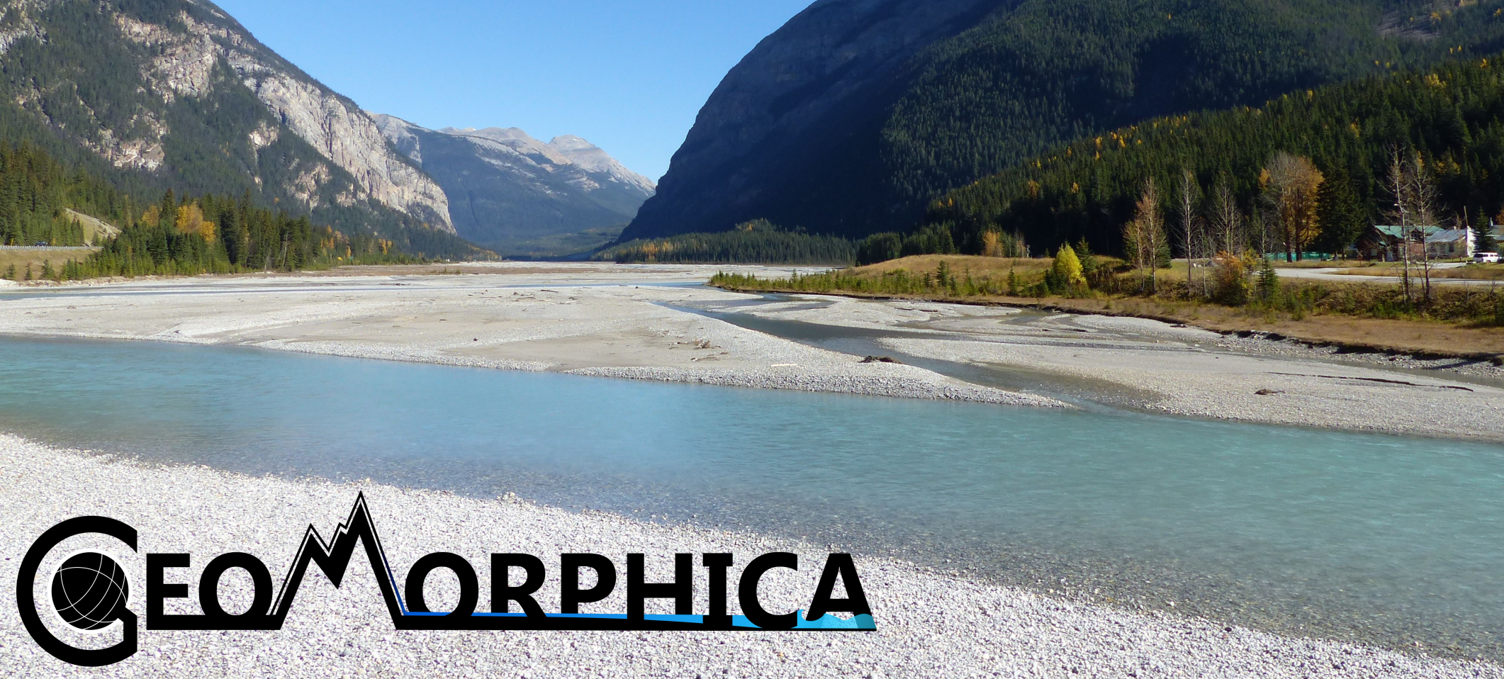 An image of a gravel-bed river flowing between mountains. A dark logo on the bottom left reads "Geomorphica". Kicking Horse River at Field, Yoho National Park Photo by: Dr Dale Leckie (@DaleALeckie)