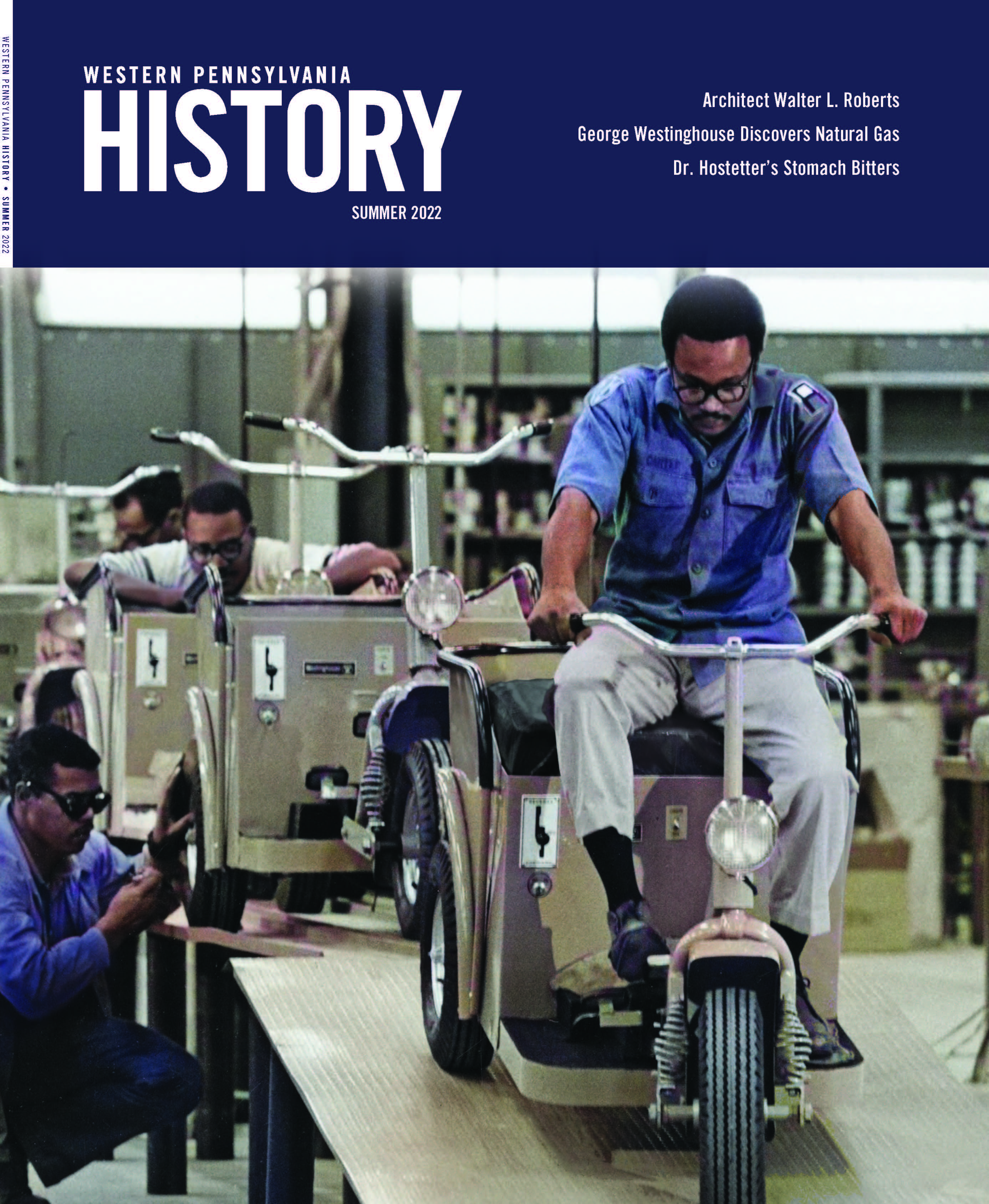 Magazine cover with photo of men inspecting and working on electric tricycles.